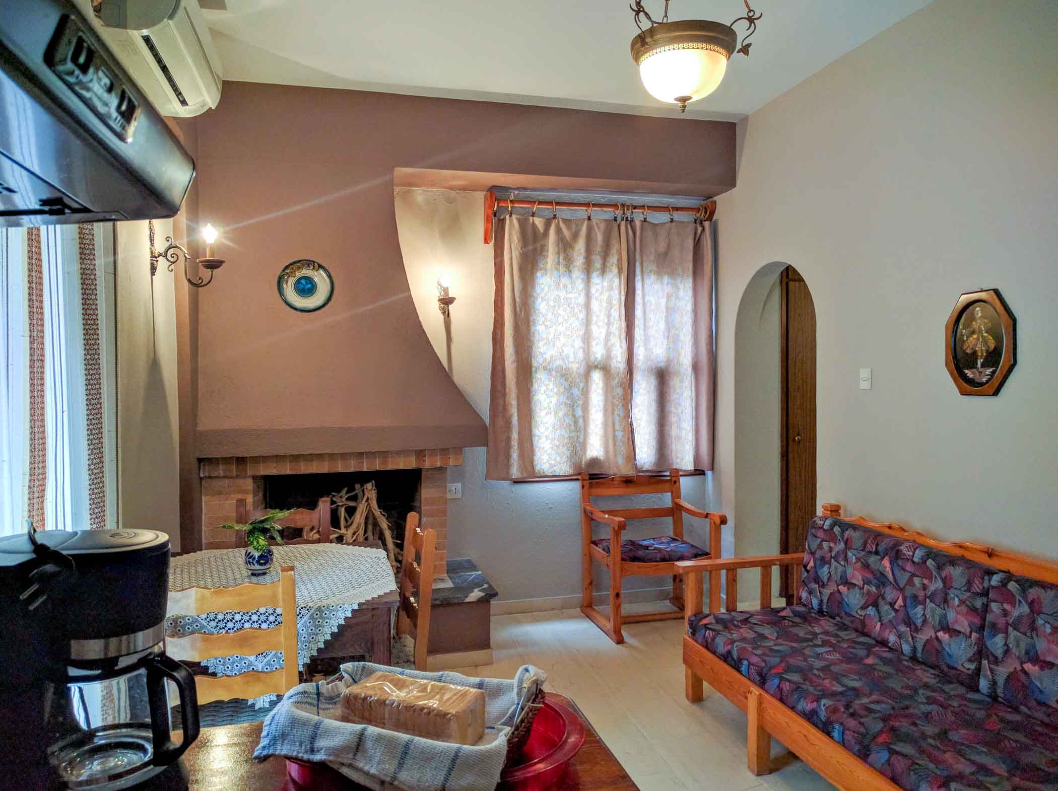 Kitchen, dining area and bedroom with fireplace